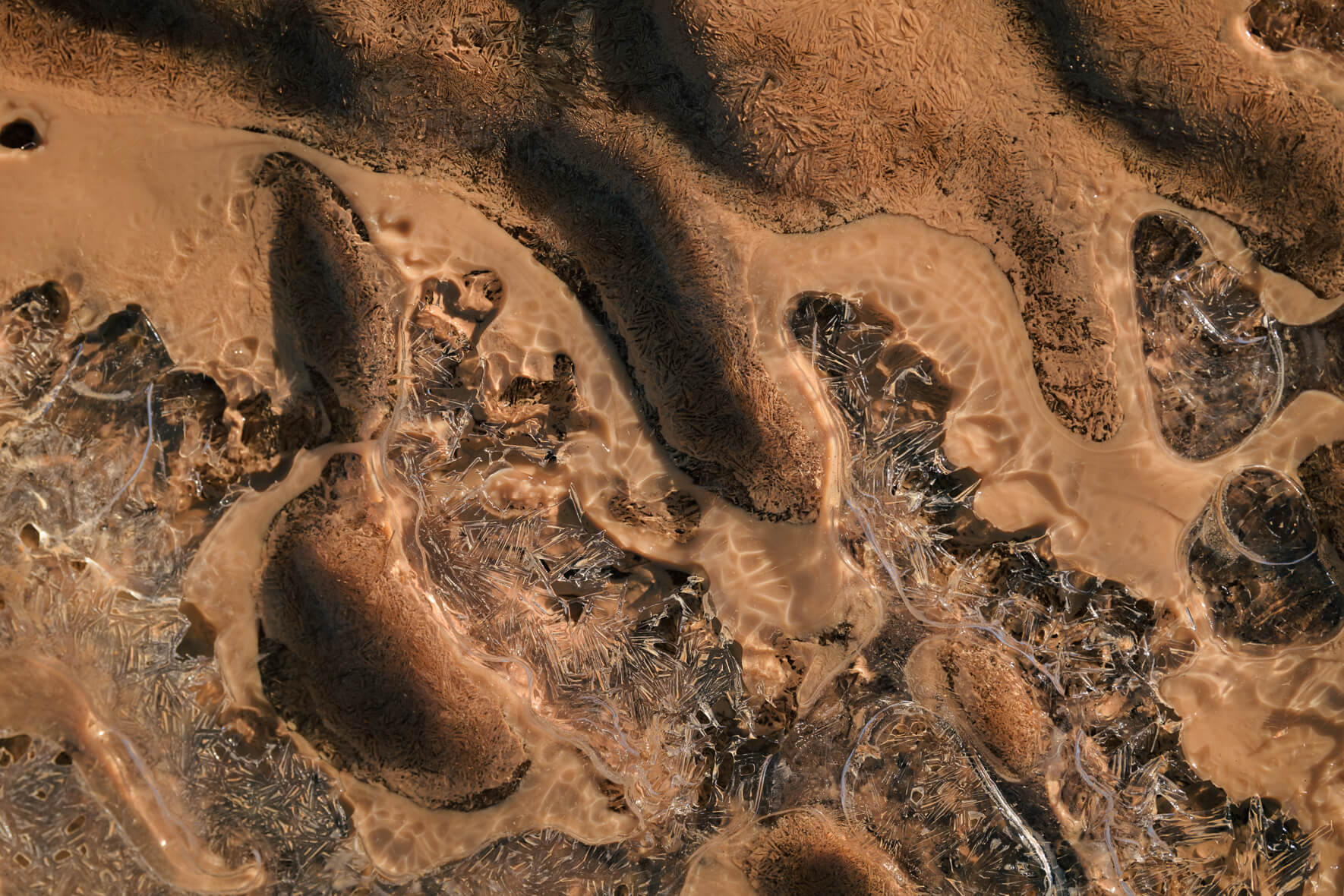 Macro photography of a frozen puddle at Námafjall geothermal area in Iceland
