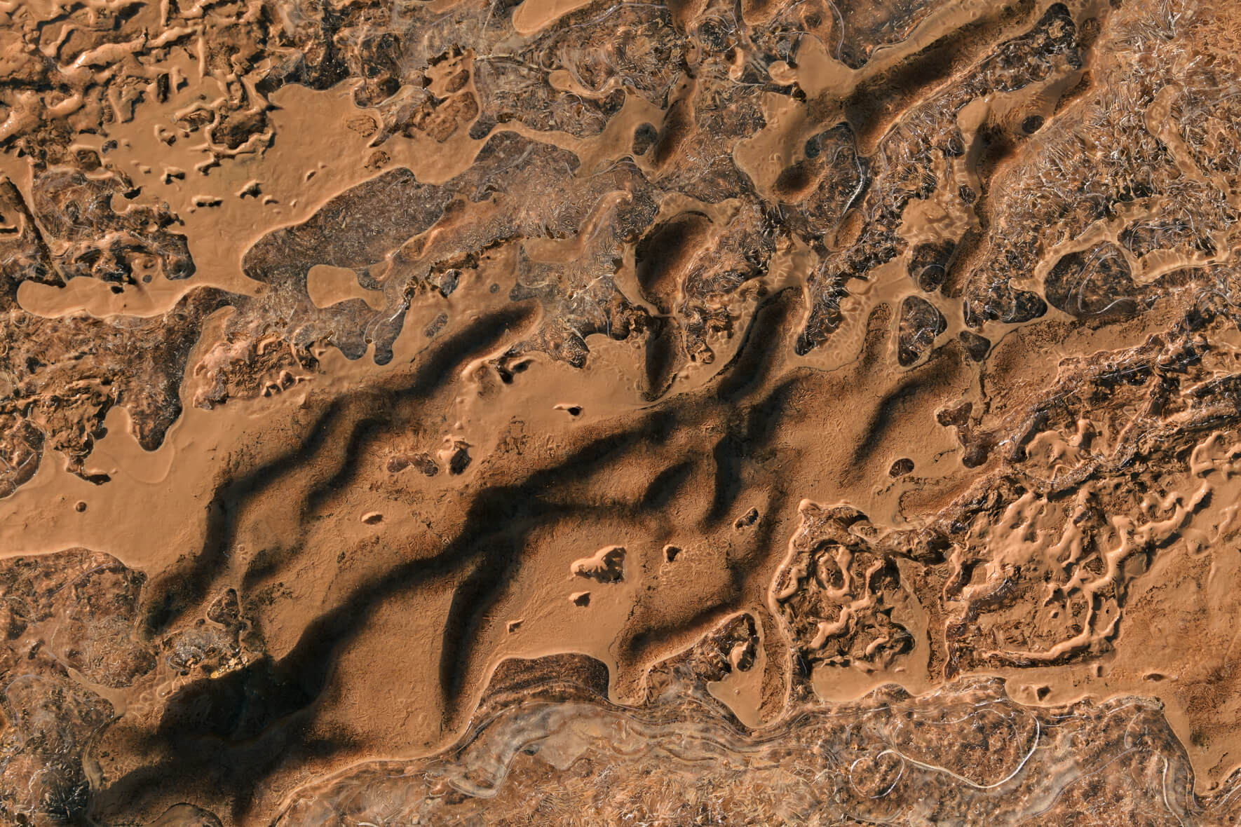 Abstract macro photography of a frozen creek in winter