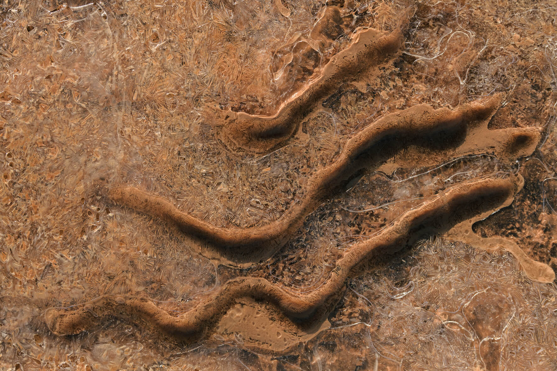 Macro photography of a frozen creek at Námafjall geothermal area in Iceland