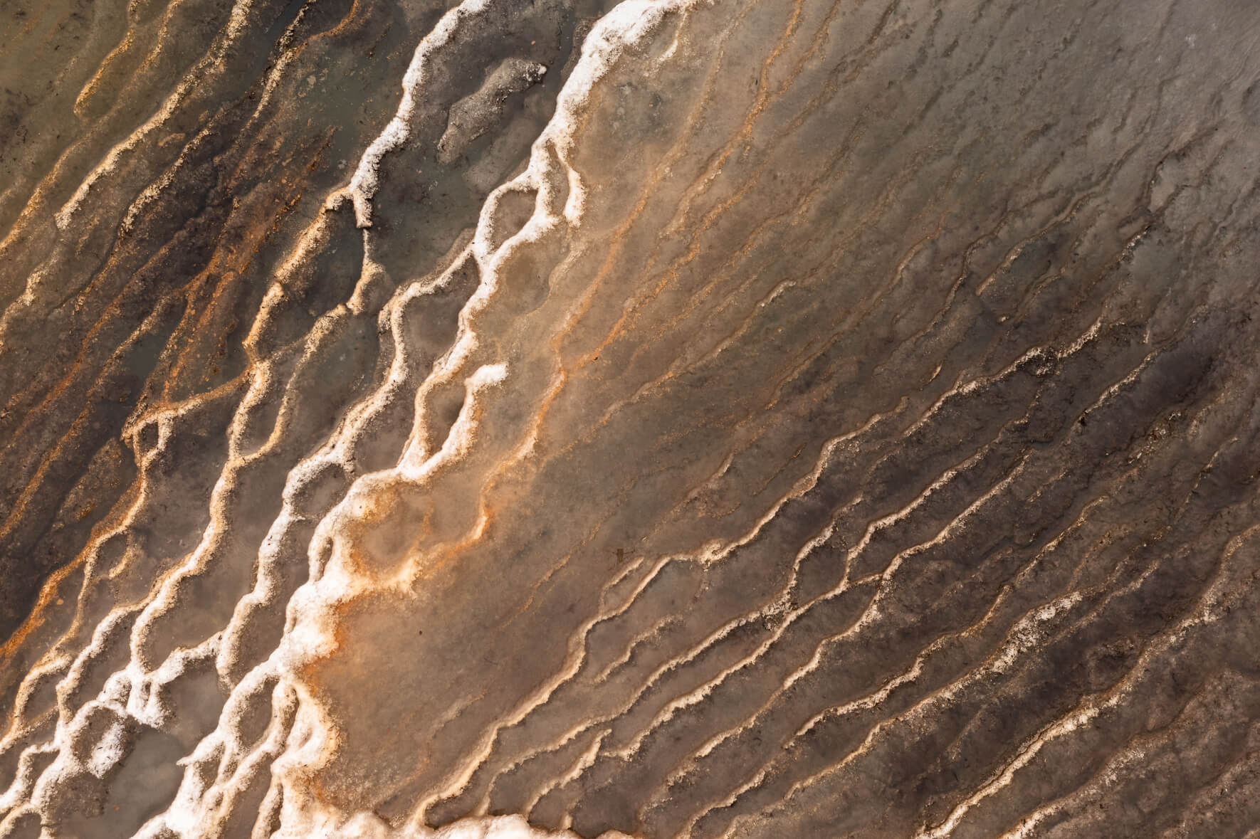 Colorful texture of frozen ponds on Jökuldalsheiði plateau in eastern Iceland