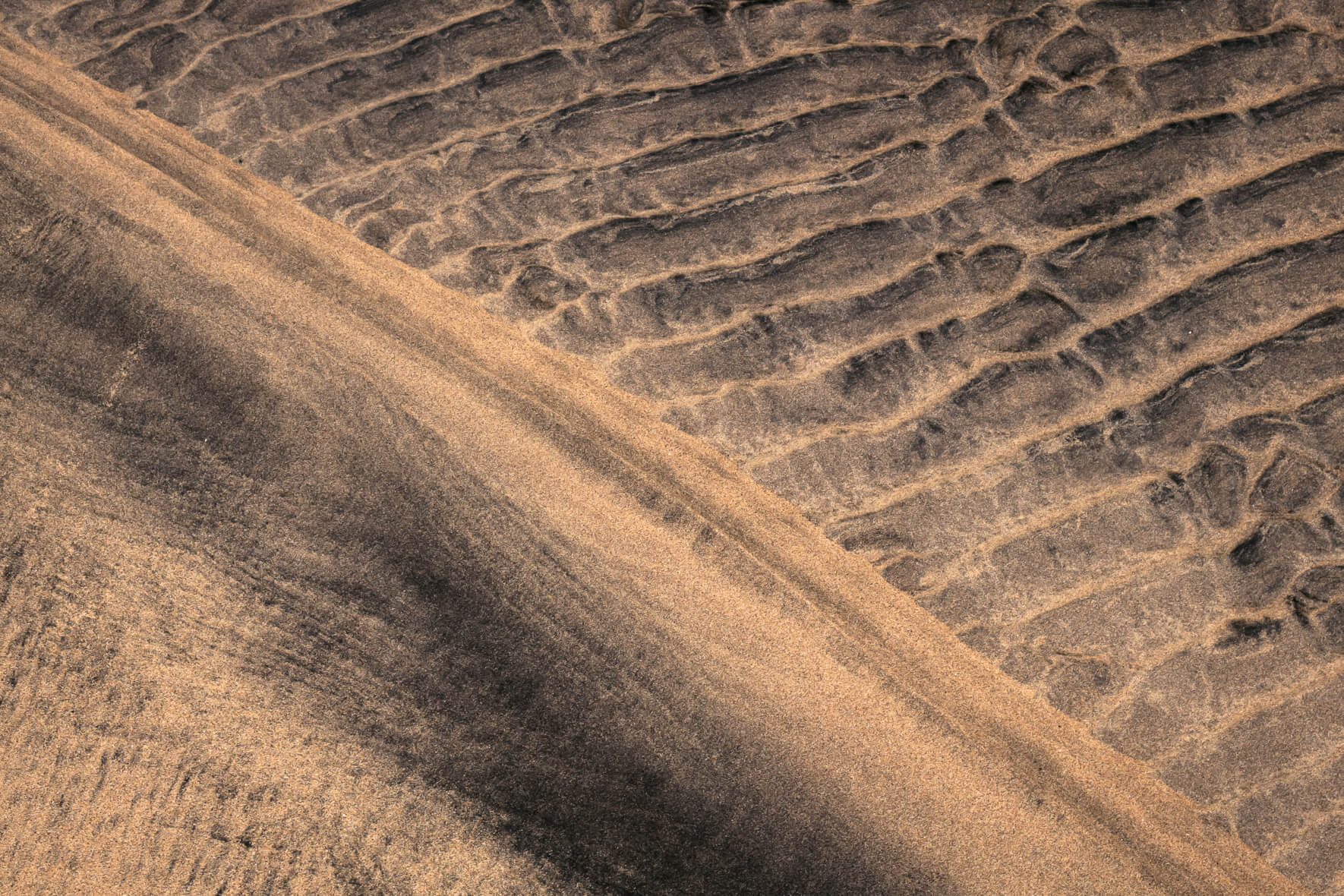 Aerial view of textures in the sand of a beach in the Westfjords of Iceland