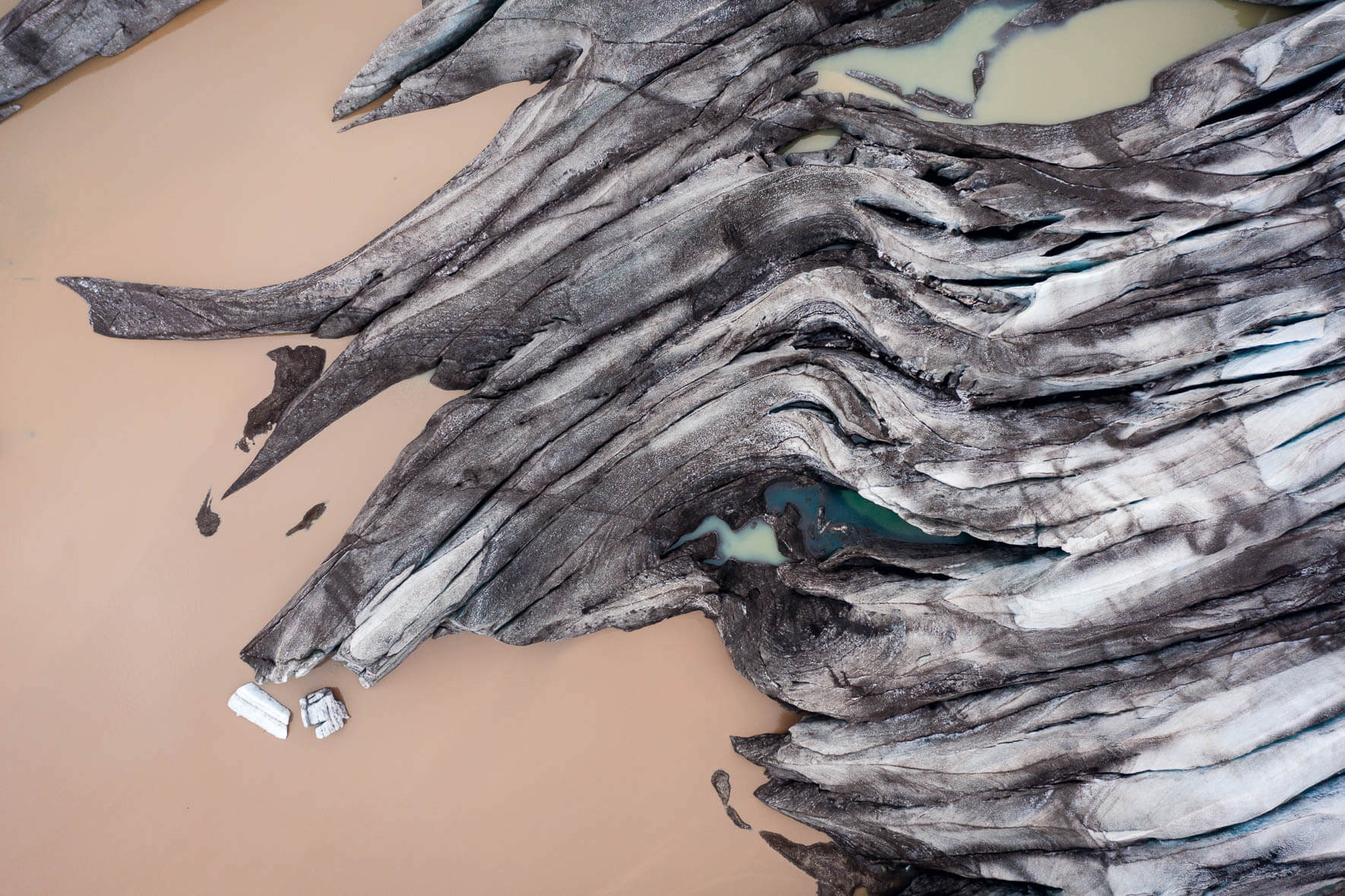 Fláajökull glacier in Iceland and small glacial lake with blue water