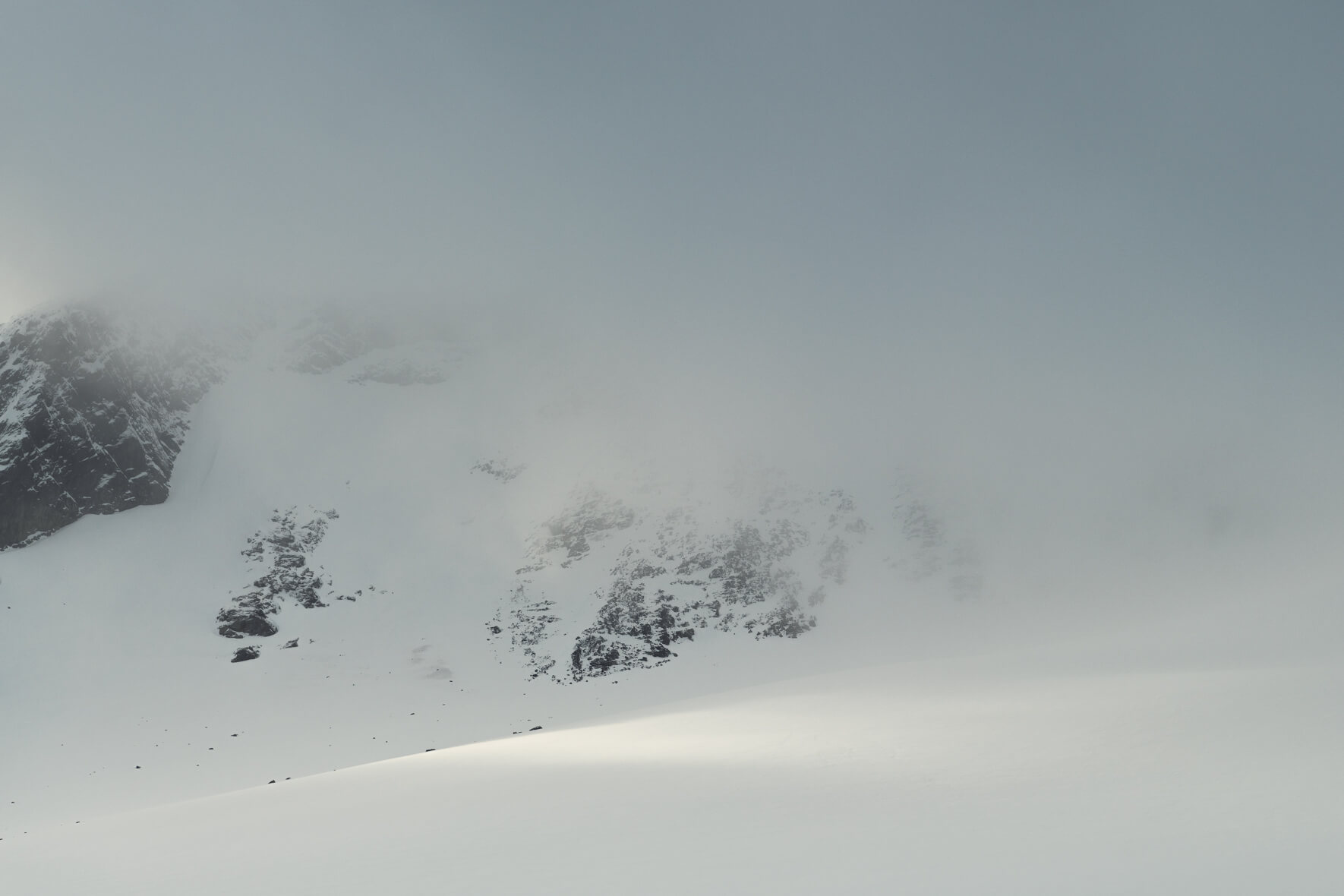 Soft light and snow clouds over the Sognefjellet mountains in Norway