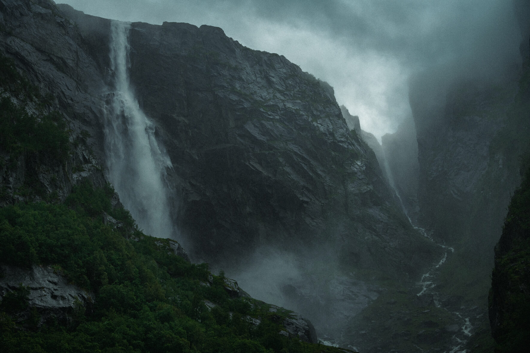 Dramatic weather over Skytjefossen waterfall in the Simadalen valley east of Eidfjord in Norway
