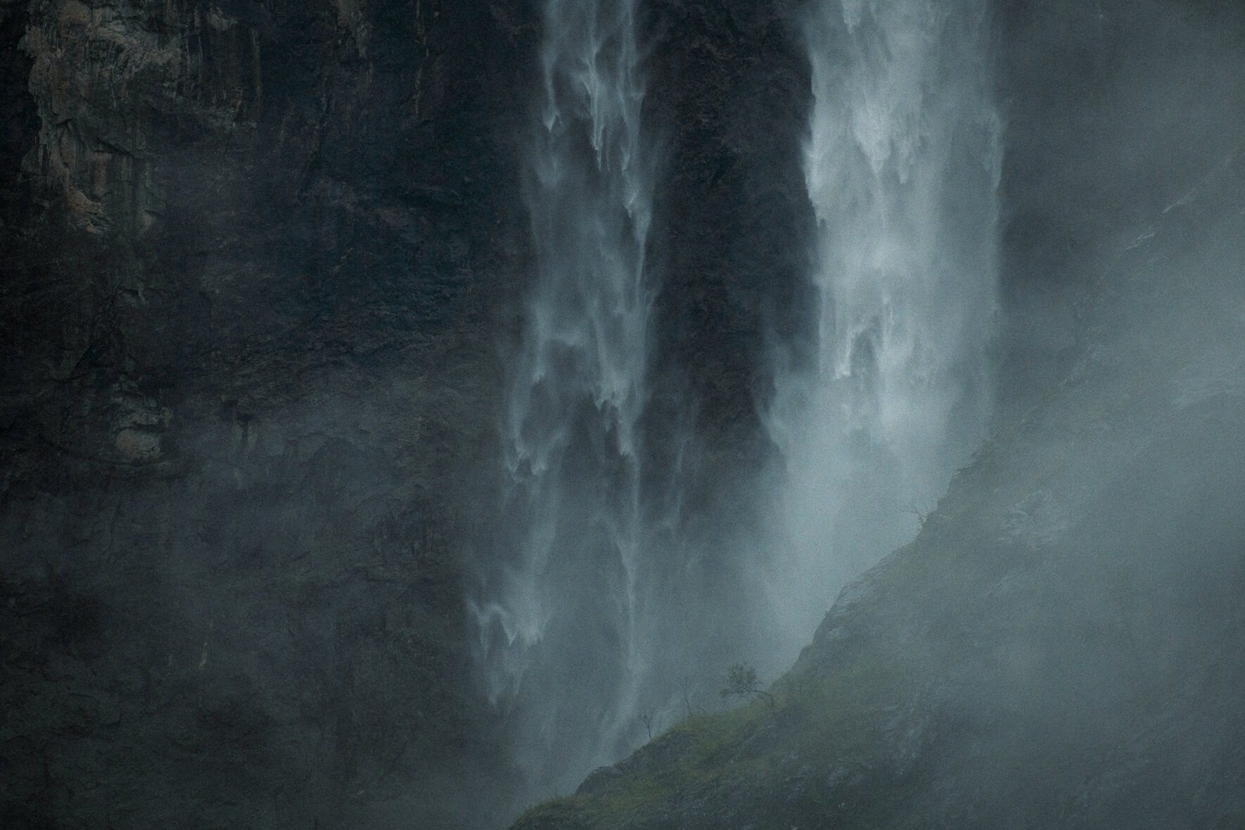 Twin waterfall near Øvre Eidfjord in dramatic weather