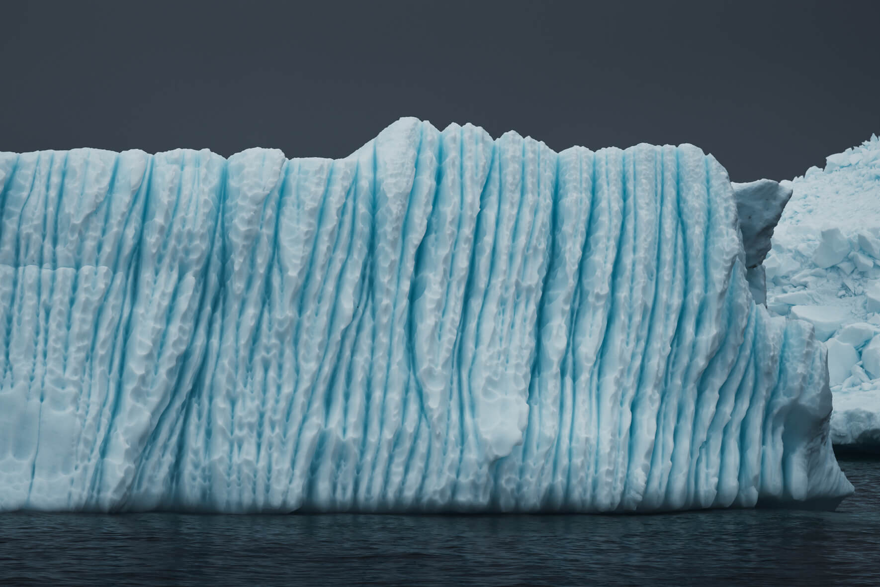 Blue water channels in an iceberg in Antarctica near Neko Harbour