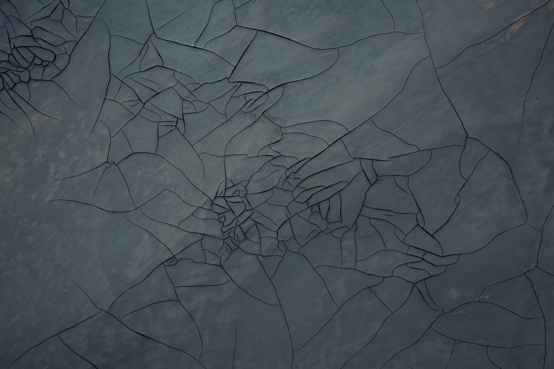 Aerial view of intricate mud cracks in Námafjall geothermal field, Iceland
