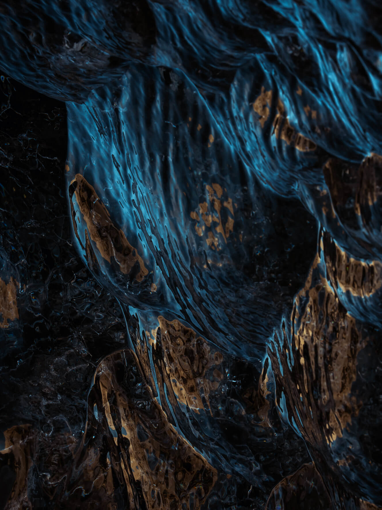 Sunlight reflecting on the dark blue glacial ice of Vatnajökull glacier in Iceland