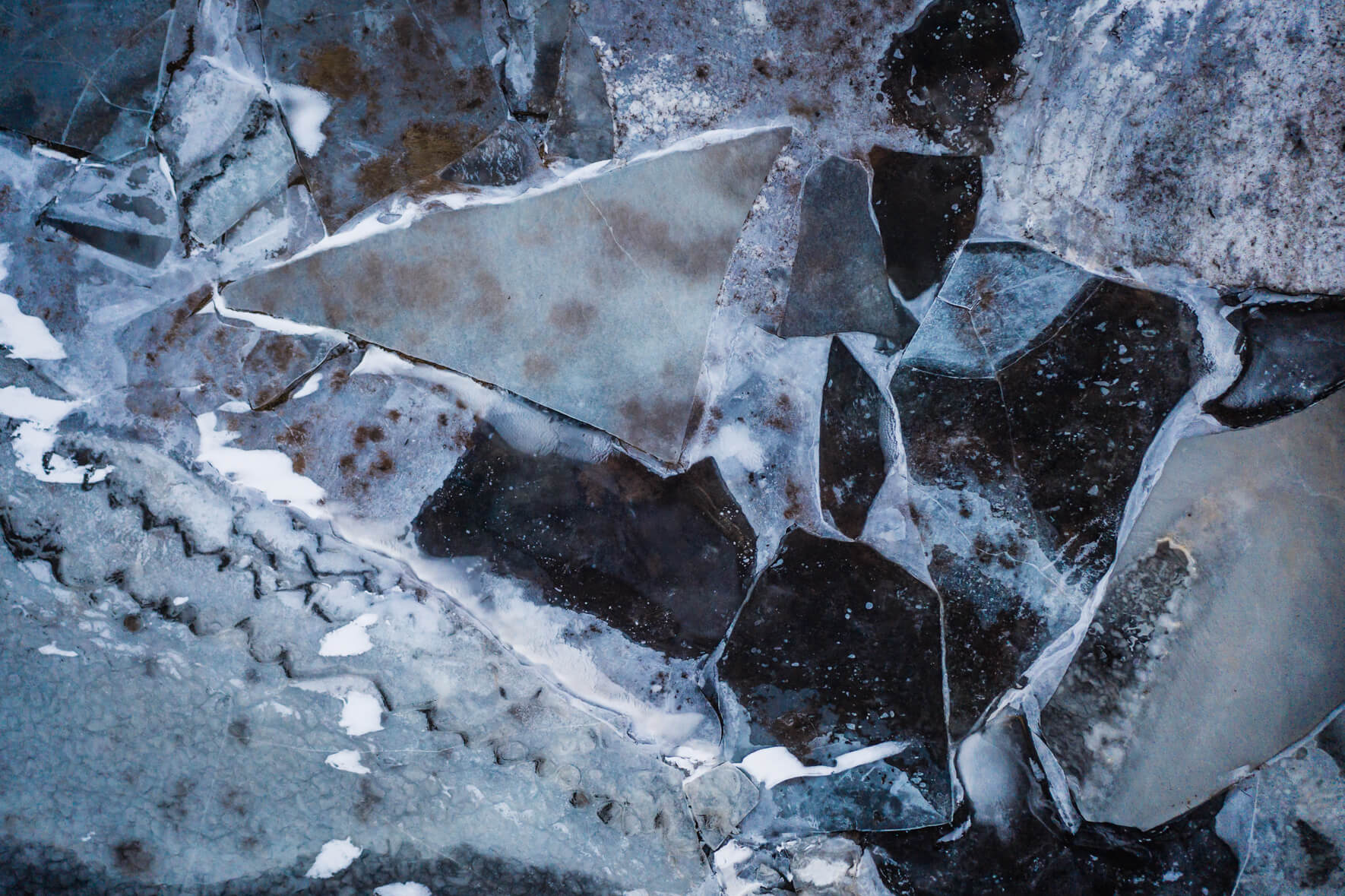 Abstract and colorful puzzle of ice floes on the frozen river Ölfusá in Iceland
