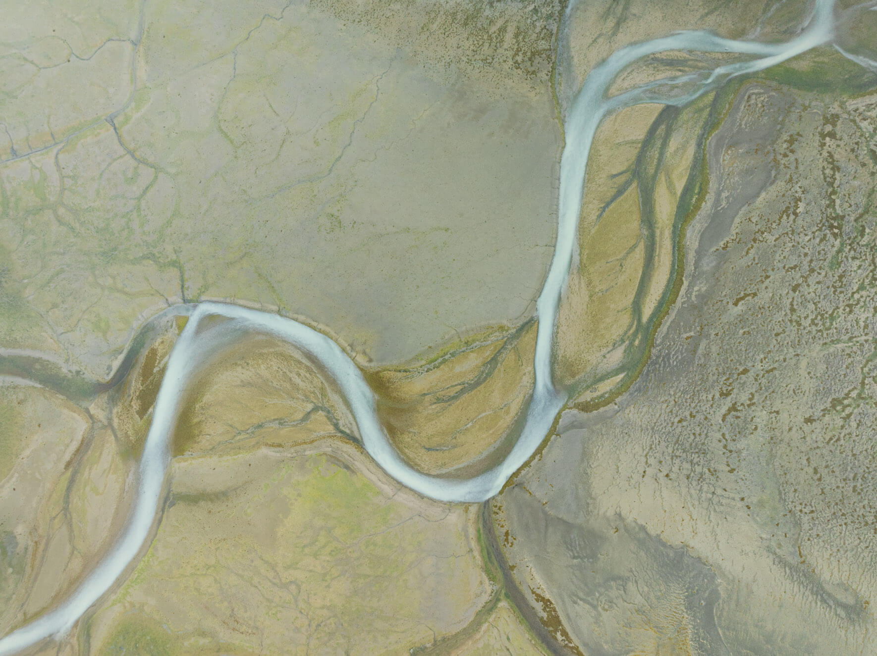 Aerial perspective of Alaska’s swamplands with winding river channels