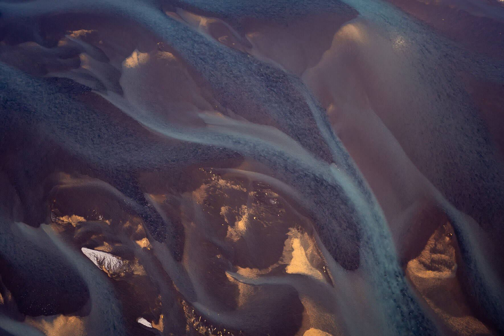 Aerial view of colorful glacial rivers in Iceland