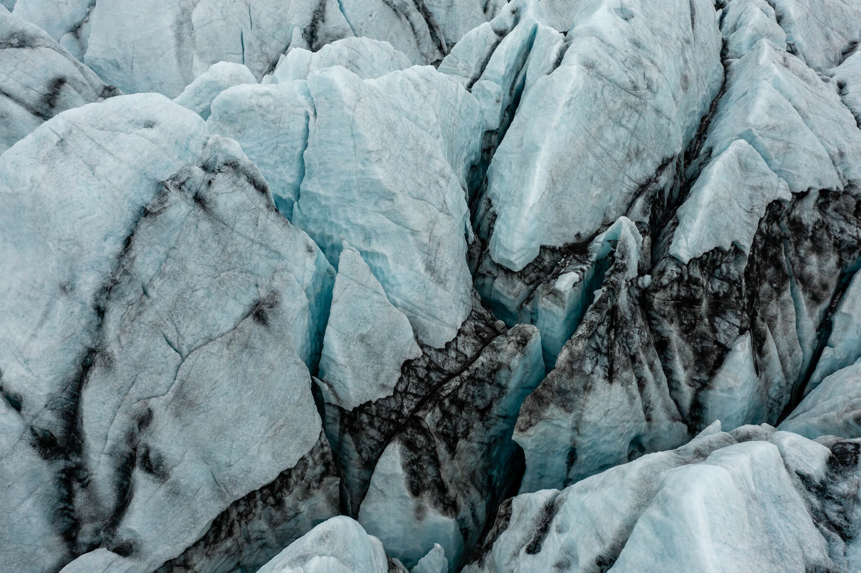 Aerial view of Breiðamerkurjökull glacier in Iceland with crevasses