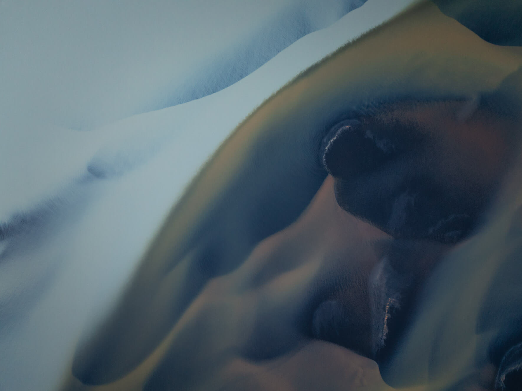 Aerial perspective of Iceland’s glacial rivers highlighting milky water and golden hues