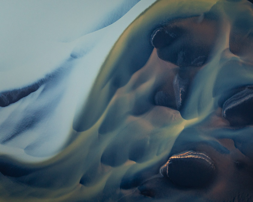 Drone shot of Iceland’s Þjórsá River delta showcasing striking sediment contrasts and small sand islands