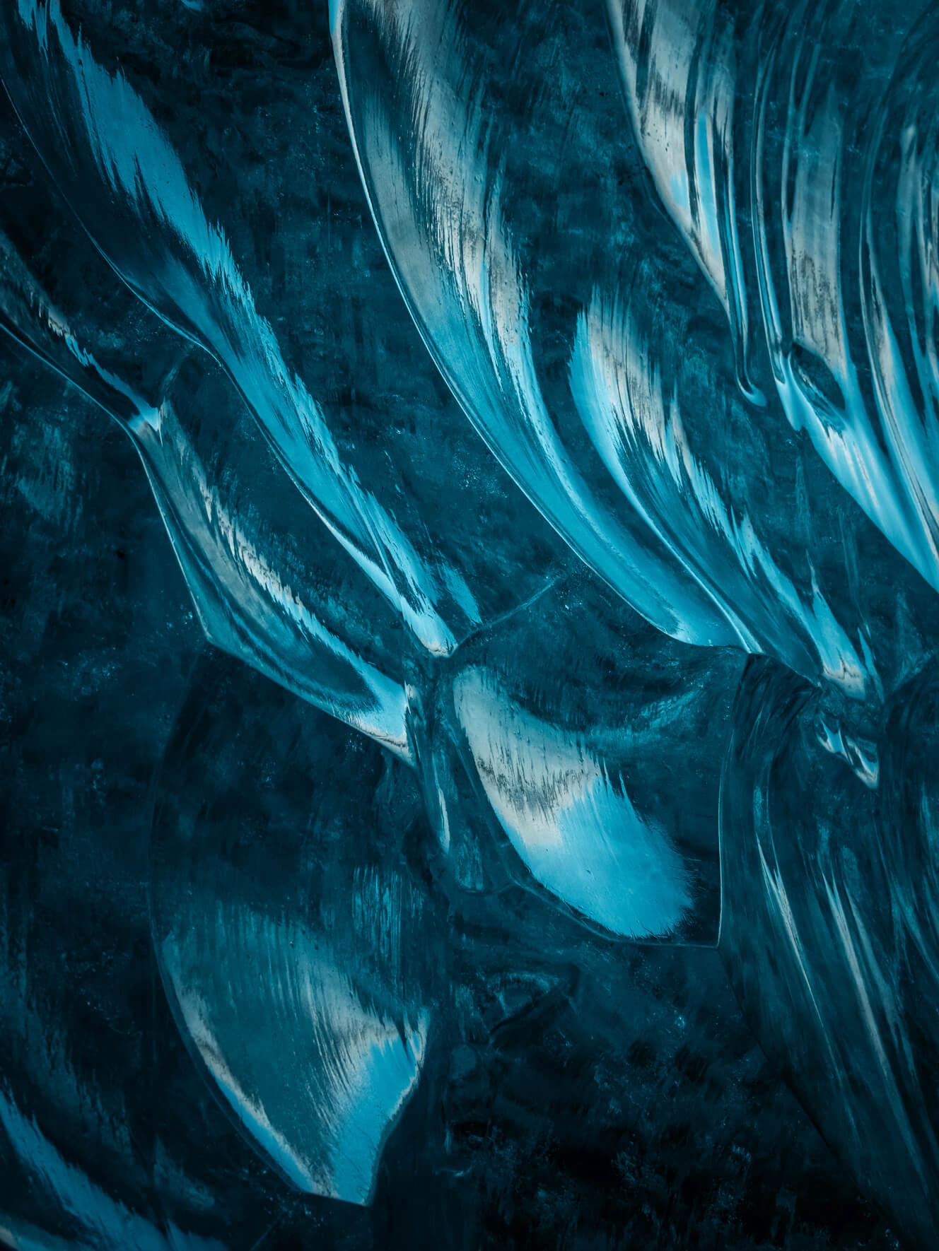 Blue ice of Breiðamerkurjökull glacier in Iceland with light reflections