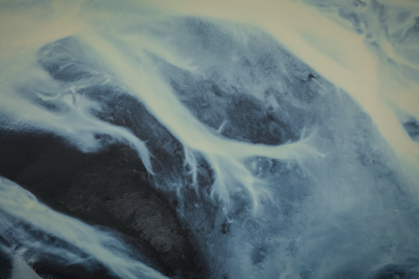 Abstract aerial view of a glacial river on the south coast of Iceland with brown water