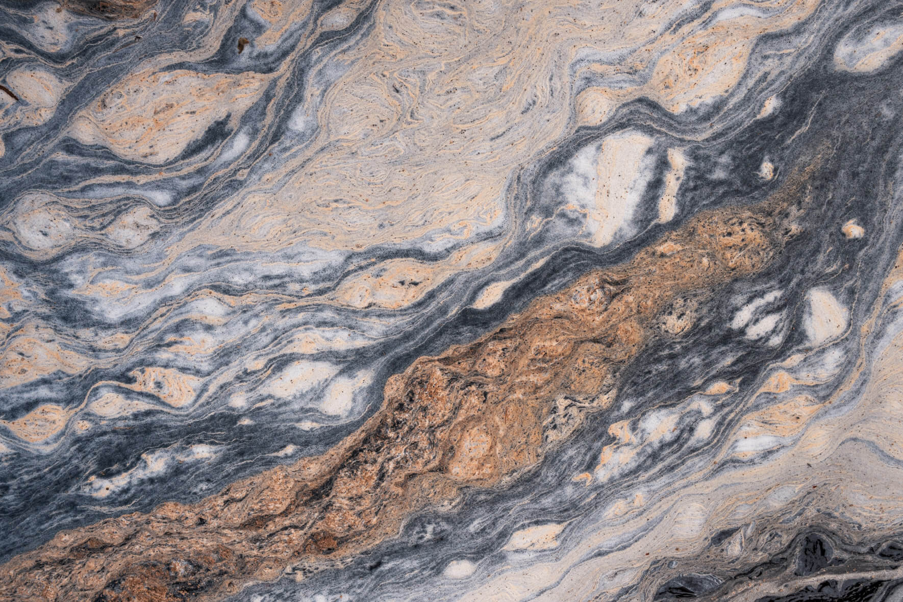 Close view of pollen-covered water with patterns reminiscent of Jupiter’s surface