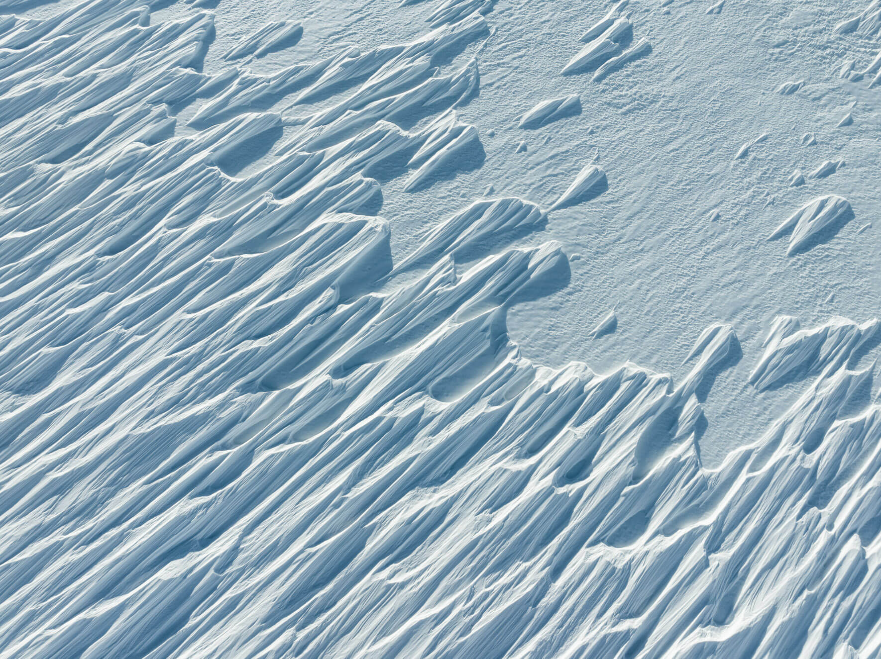 Snow drift patterns shaped by wind captured from above in Norway’s Hardangervidda region