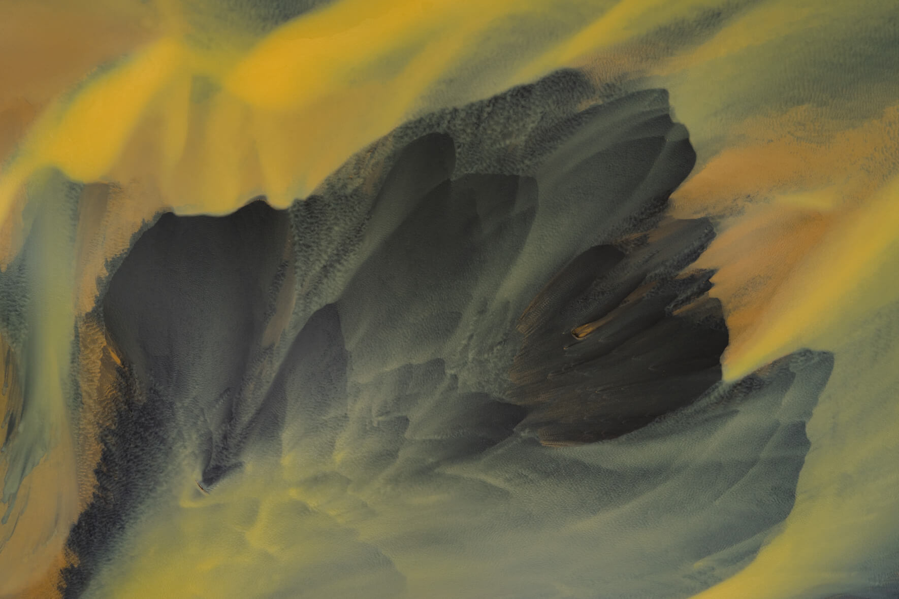 Aerial view of geothermal river in Iceland blending warm tones and dark glacial flow