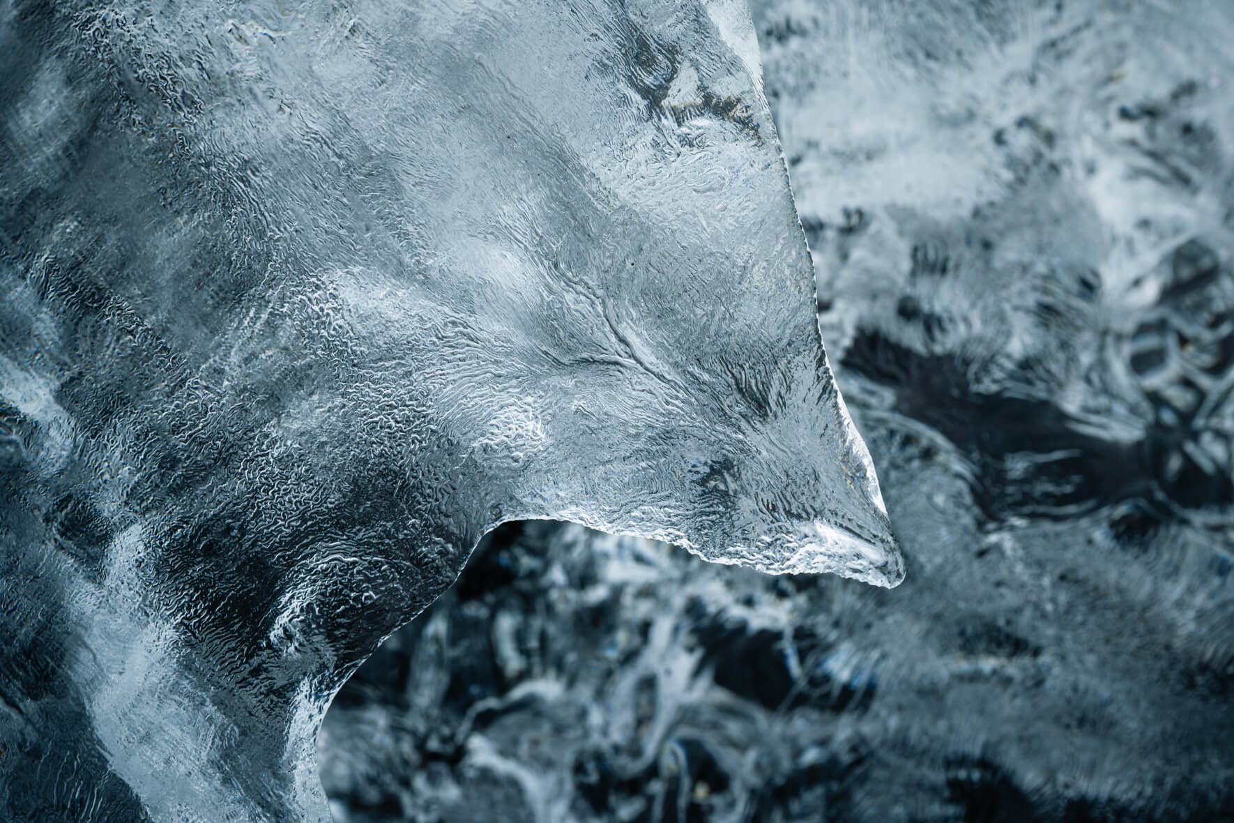 Macro view of glacial ice on Diamond Beach in Iceland with fragile details
