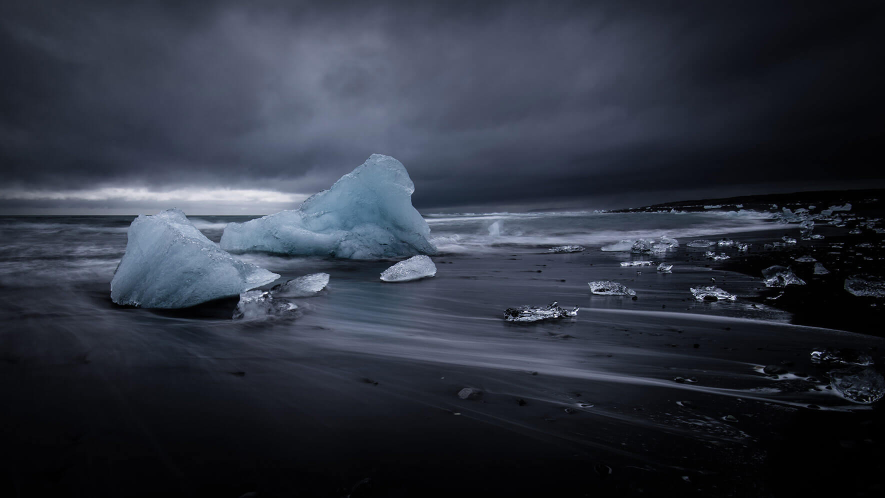Black sand beach with blue icebergs in Iceland