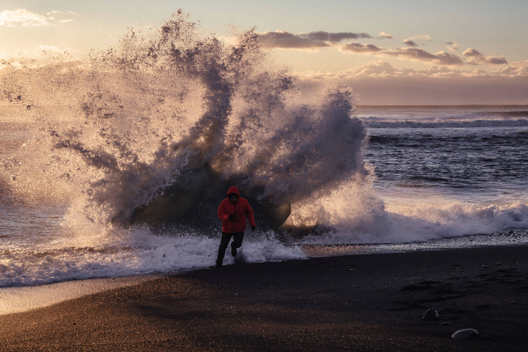 Waves and iceberg on the beach of Jökulsárlón Glacier Lagoon