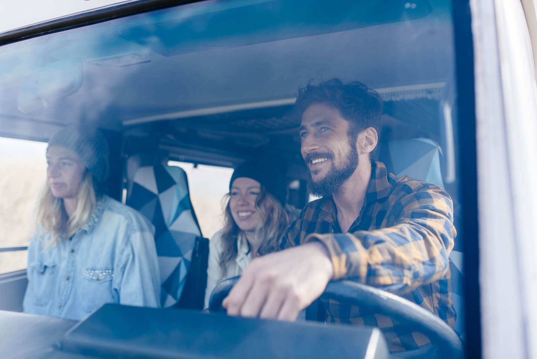 Friends on a road trip in old camper van