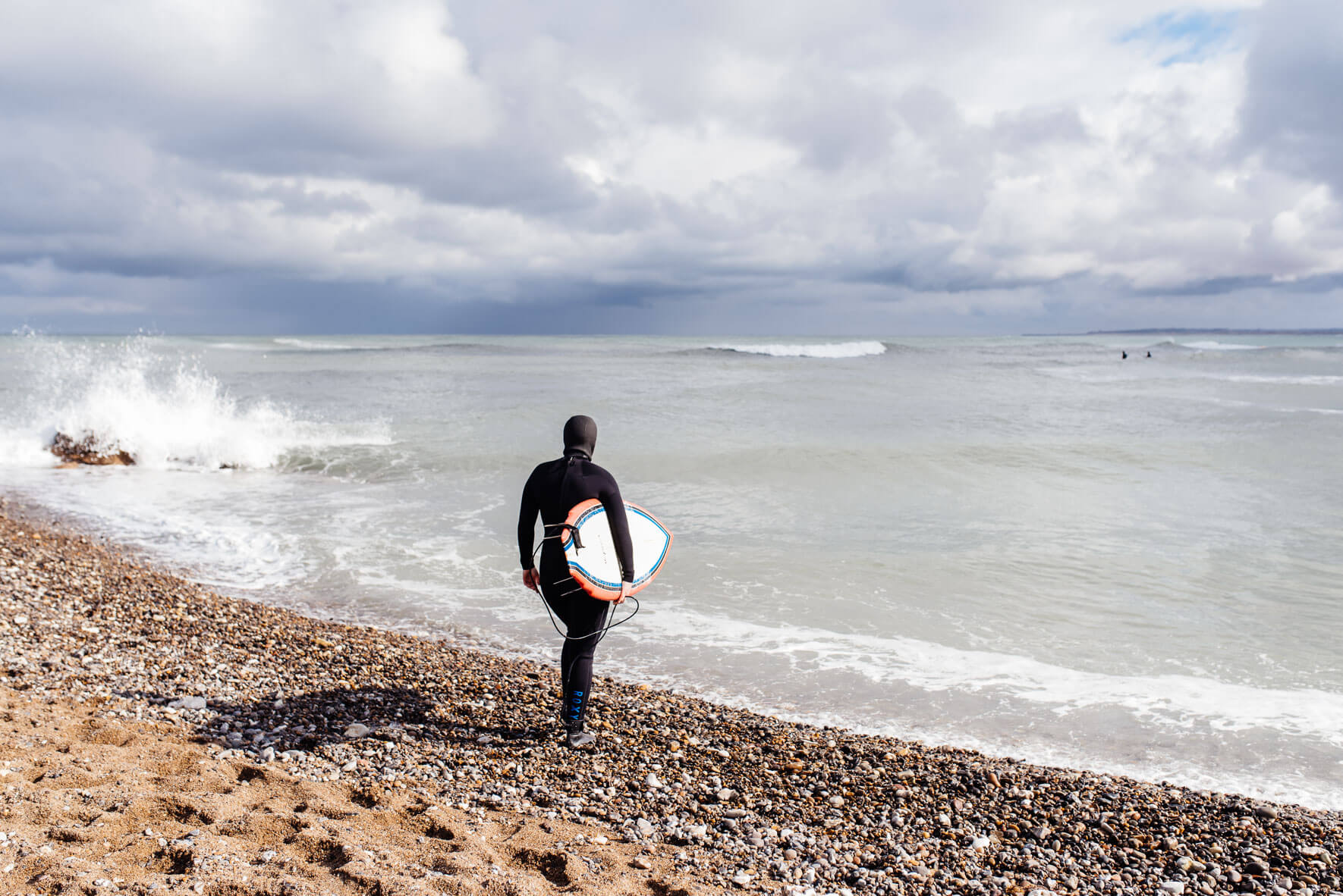 Surfer on the beach of Klitmøller in Denmark