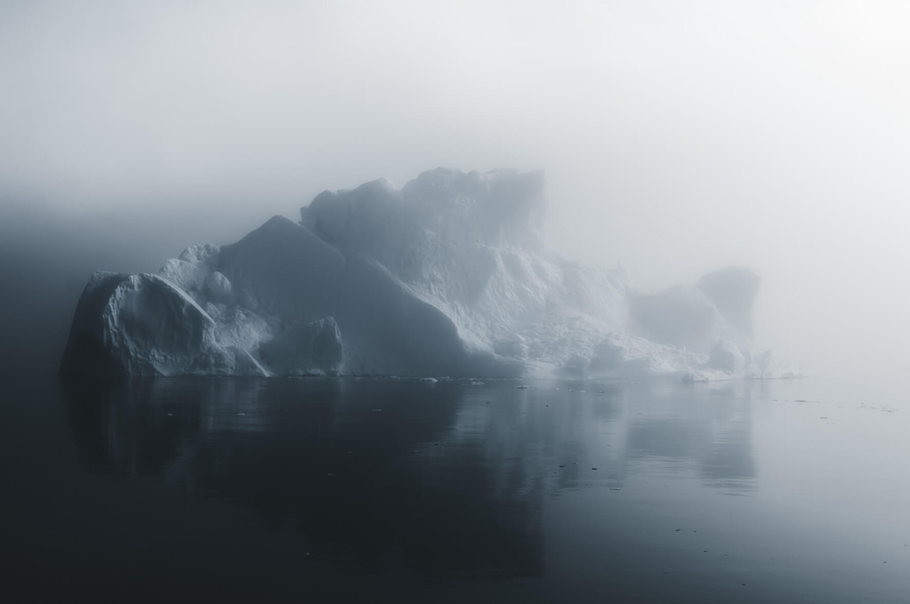 Arctic seascape with iceberg in fog (Disko Bay, Greenland)