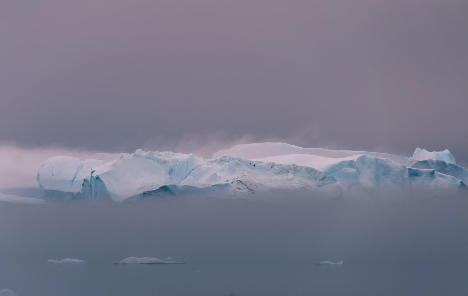 Iceberg with fog in the Disko Bay of West Greenland