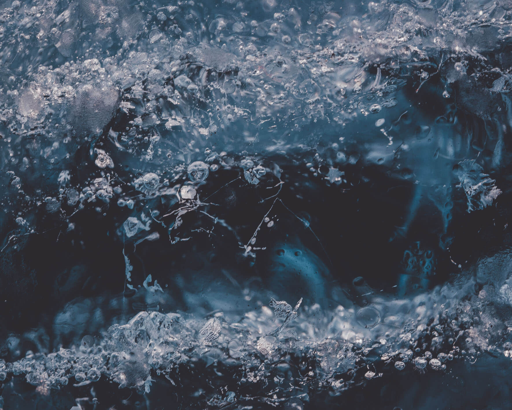 Blue glacier ice with air bubbles in Iceland