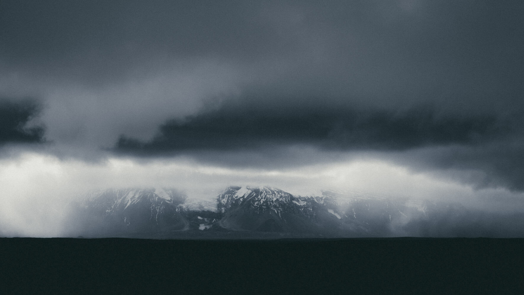 Dramatic clouds over Langjökull glacier and mountain range in Iceland