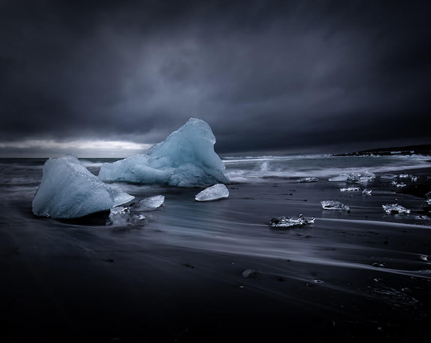 Fine art photography of icebergs on black sand beach by Jan Erik Waider