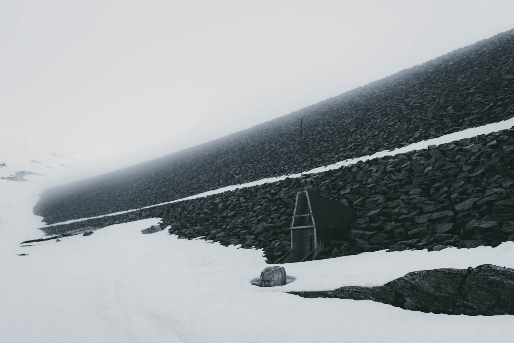 Dam at Styggevatnet - a glacial lake from the glacier Jostedalsbreen in Norway