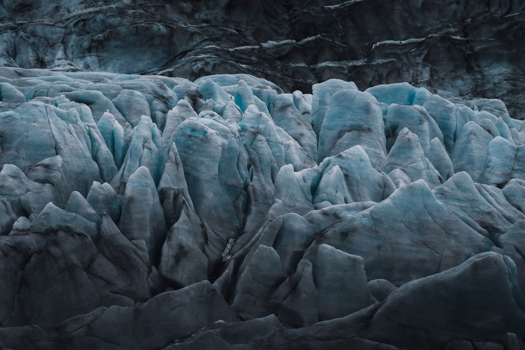 Dark glacier ice on the west coast of Svalbard in Norway