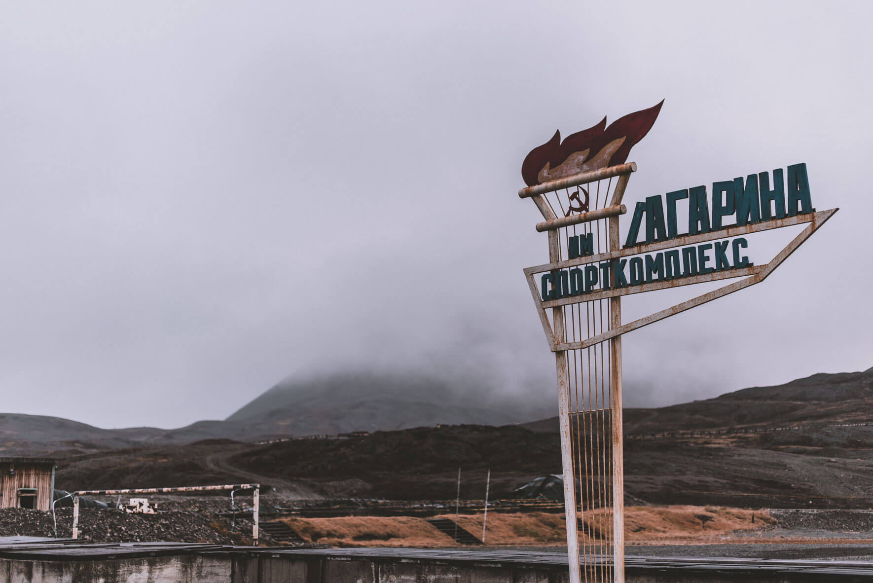 Sign of the sports hall of the abandoned Russian coal-mining settlement Pyramiden on Svalbard, Norway