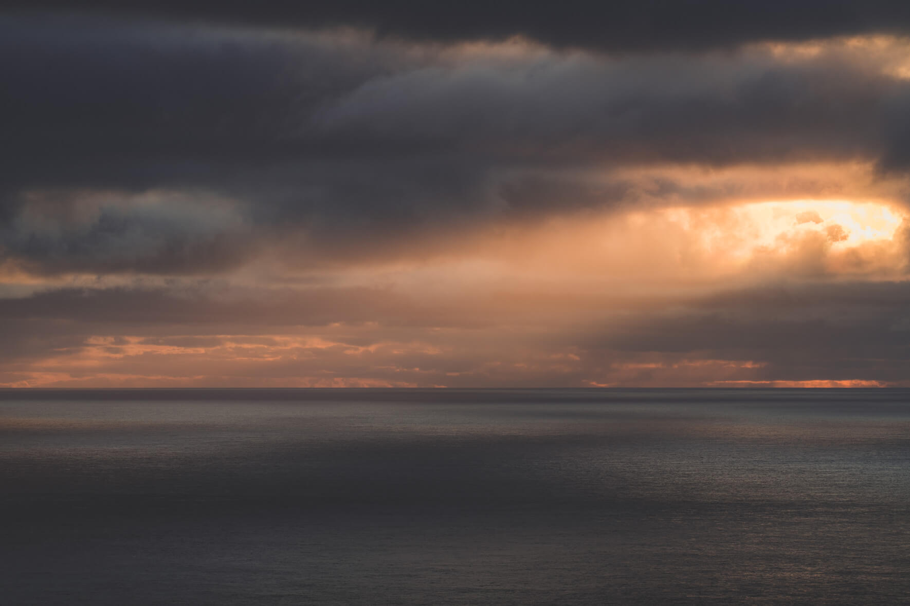Sun breaking through the Clouds during Sunset